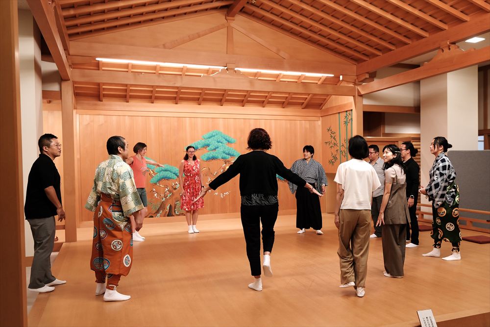International participants practising Kagura together at Yokohama Noh Theater